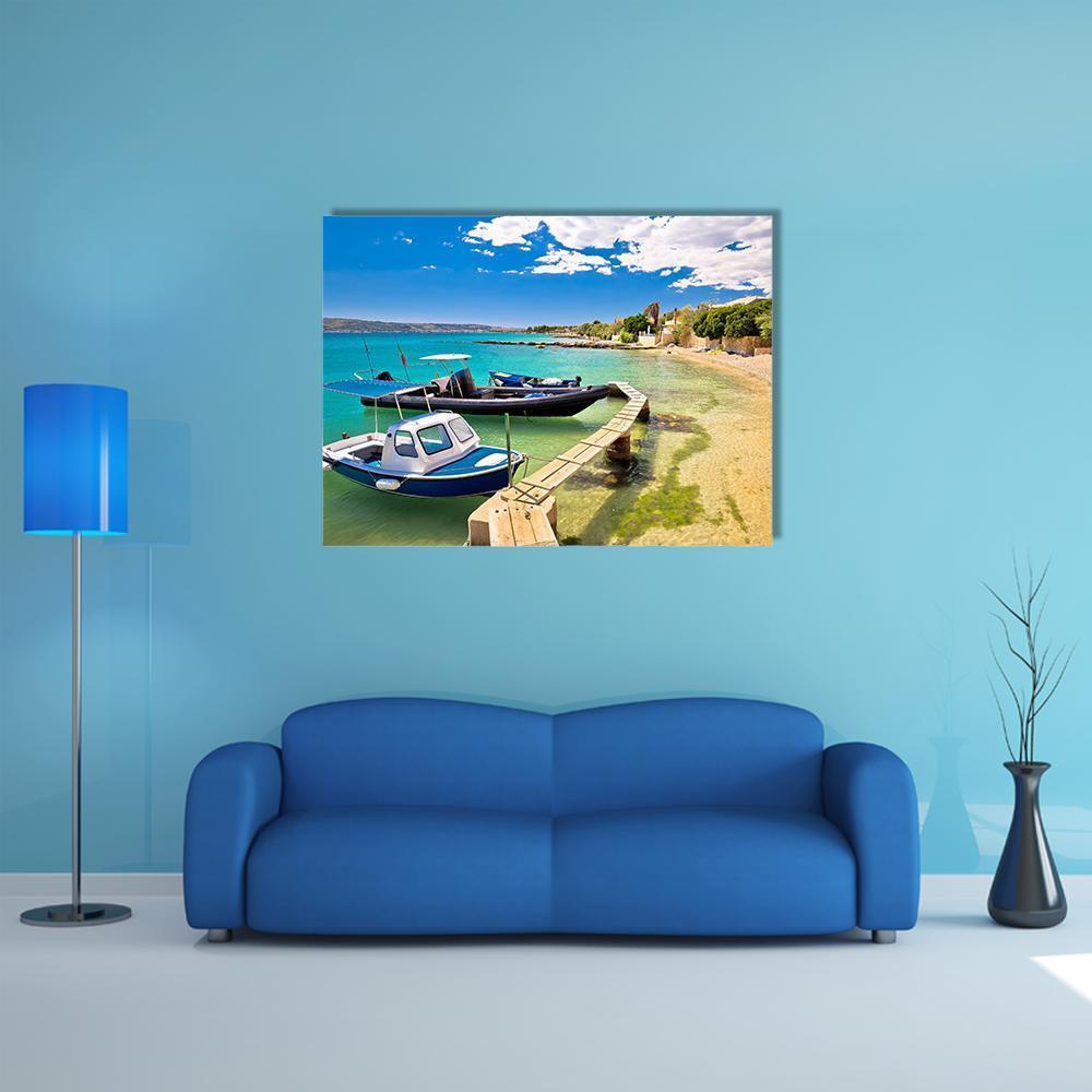 Boats on Turquoise Beach Canvas Wall Art in beige, green and blue, single panel hung on a wall