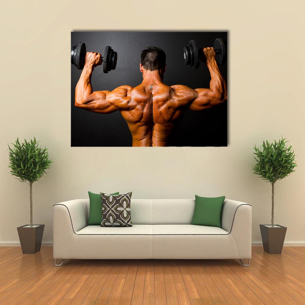 Bodybuilder Training with Dumbbells Canvas Wall Art in black and brown, single panel hung on a wall