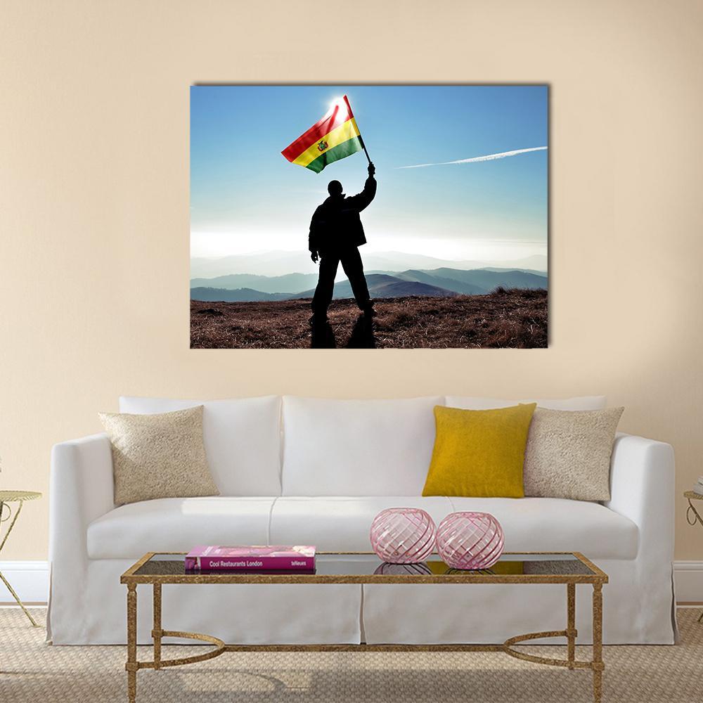 Bolivian Flag Silhouette on Mountaintop Canvas Wall Art in black, brown and blue, single panel hung on a wall