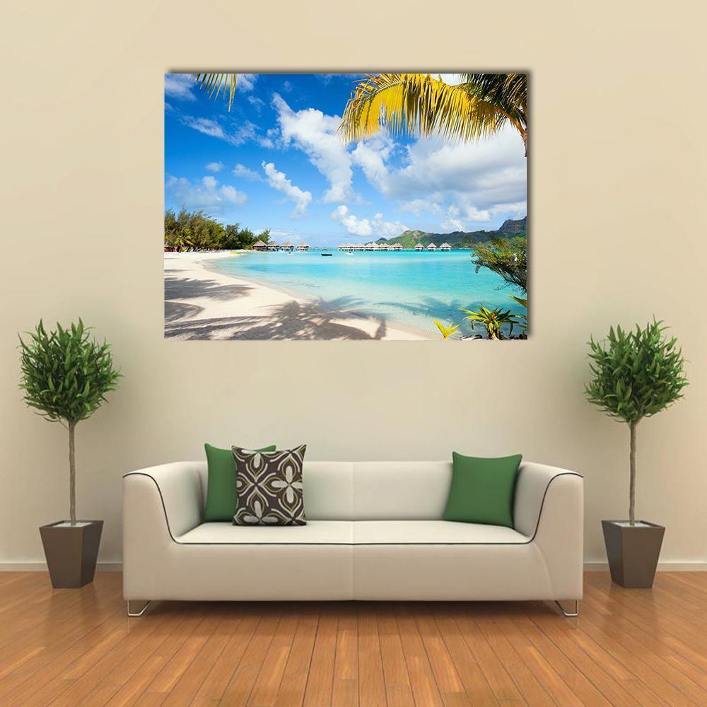 Bora Bora Island with Bungalows and Palm Trees Canvas Wall Art in white, green and blue, single panel hung on a wall