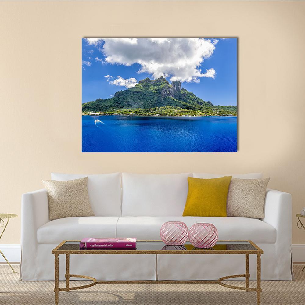 Bora Bora Mountain Over Blue Ocean Canvas Wall Art in white, green and blue, single panel hung on a wall