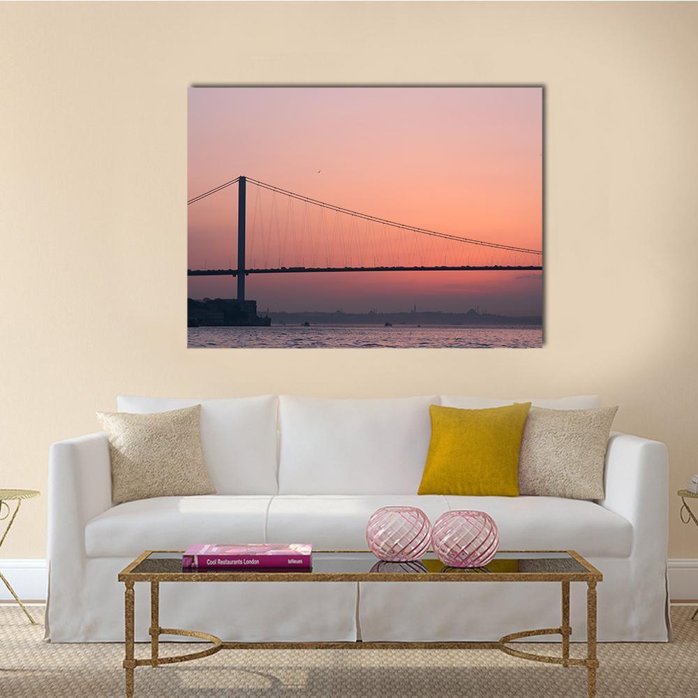 Bosphorus Bridge at Sunset Canvas Wall Art in orange, purple and pink, single panel hung on a wall