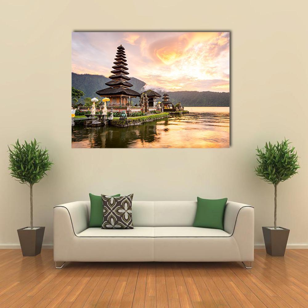 Bratan Hindu Temple at Sunset Canvas Wall Art in orange, yellow and green, single panel hung on a wall