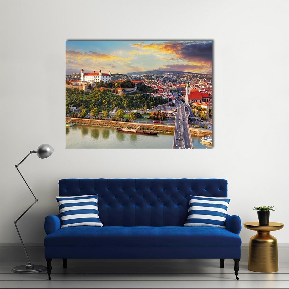 Bratislava Sunset Over the Danube Canvas Wall Art in orange, yellow and blue, single panel hung on a wall