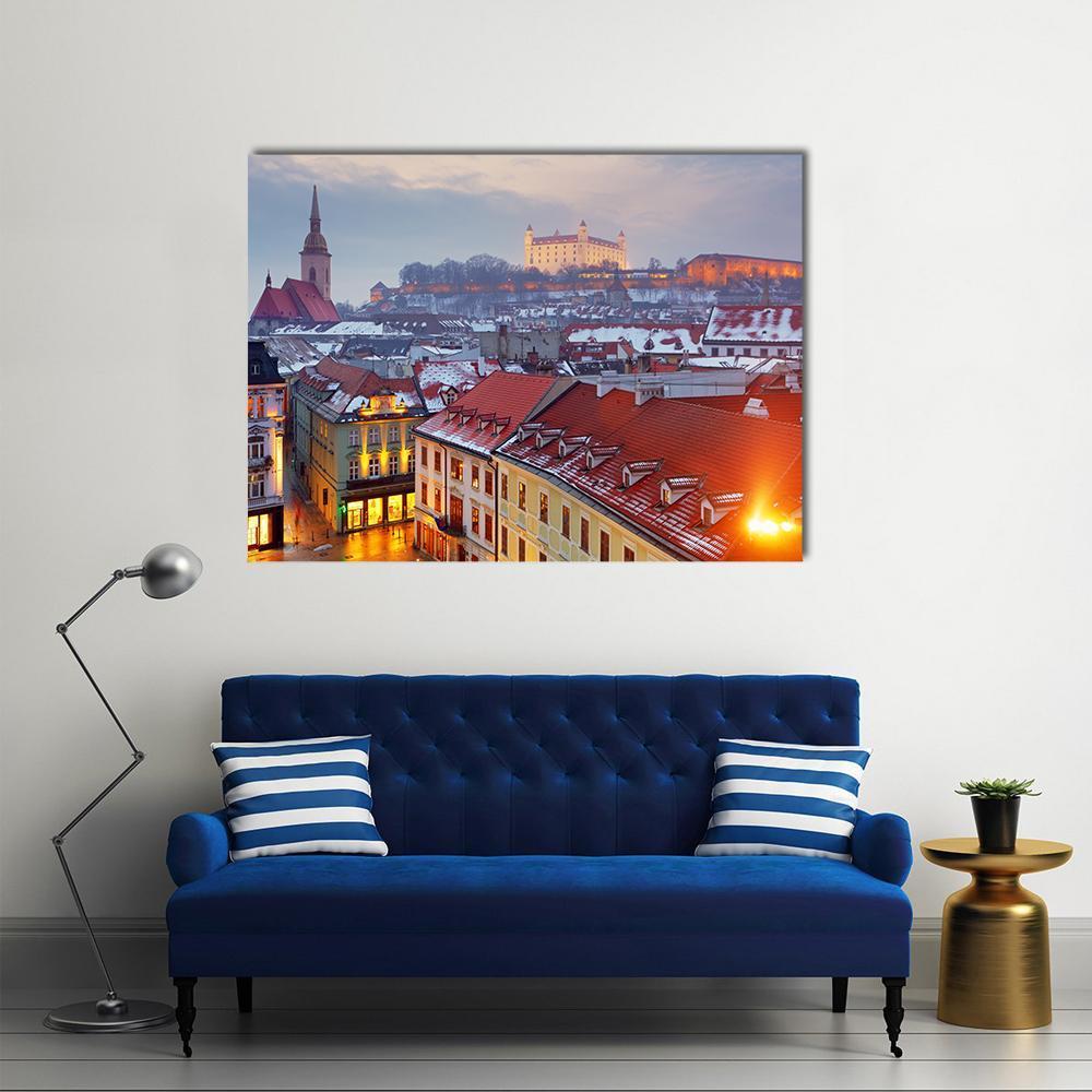 Bratislava Castle Over Snowy Old Town Canvas Wall Art in white, orange and blue, single panel hung on a wall
