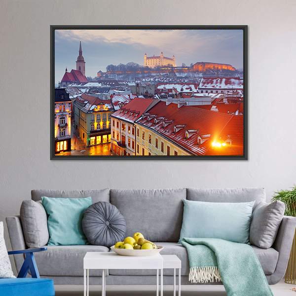 Bratislava Castle Over Snowy Old Town Canvas Wall Art in white, orange and blue, framed canvas, product view on a white background