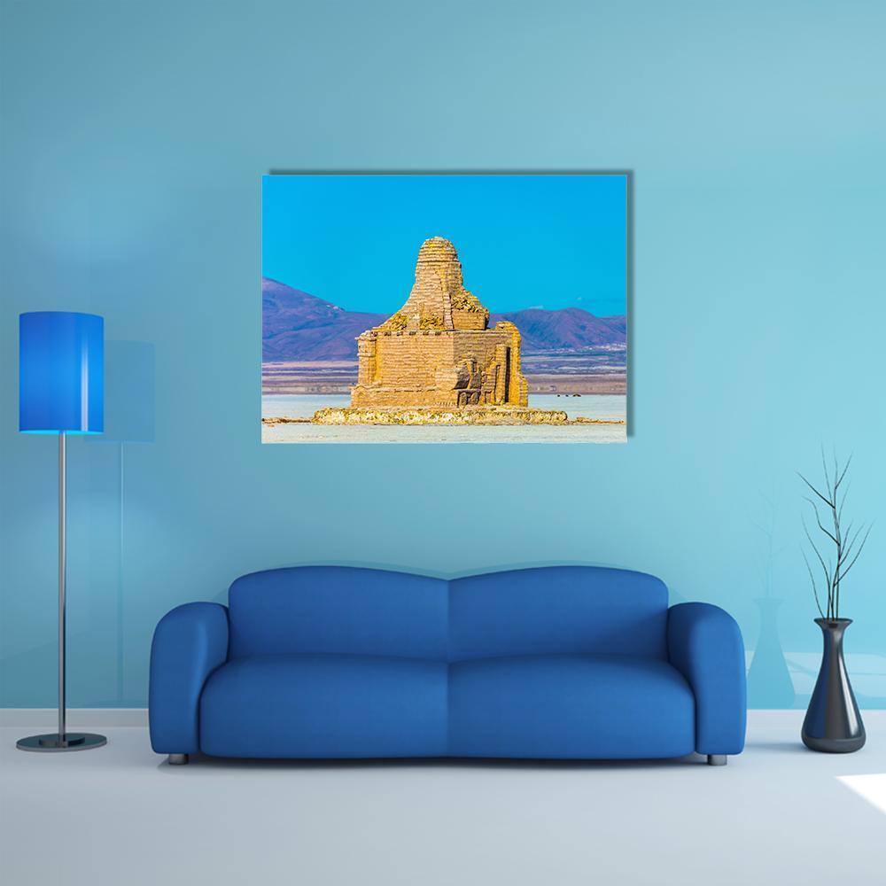 Ruined Stone Building on Salt Flats Canvas Wall Art in beige, brown and blue, single panel hung on a wall