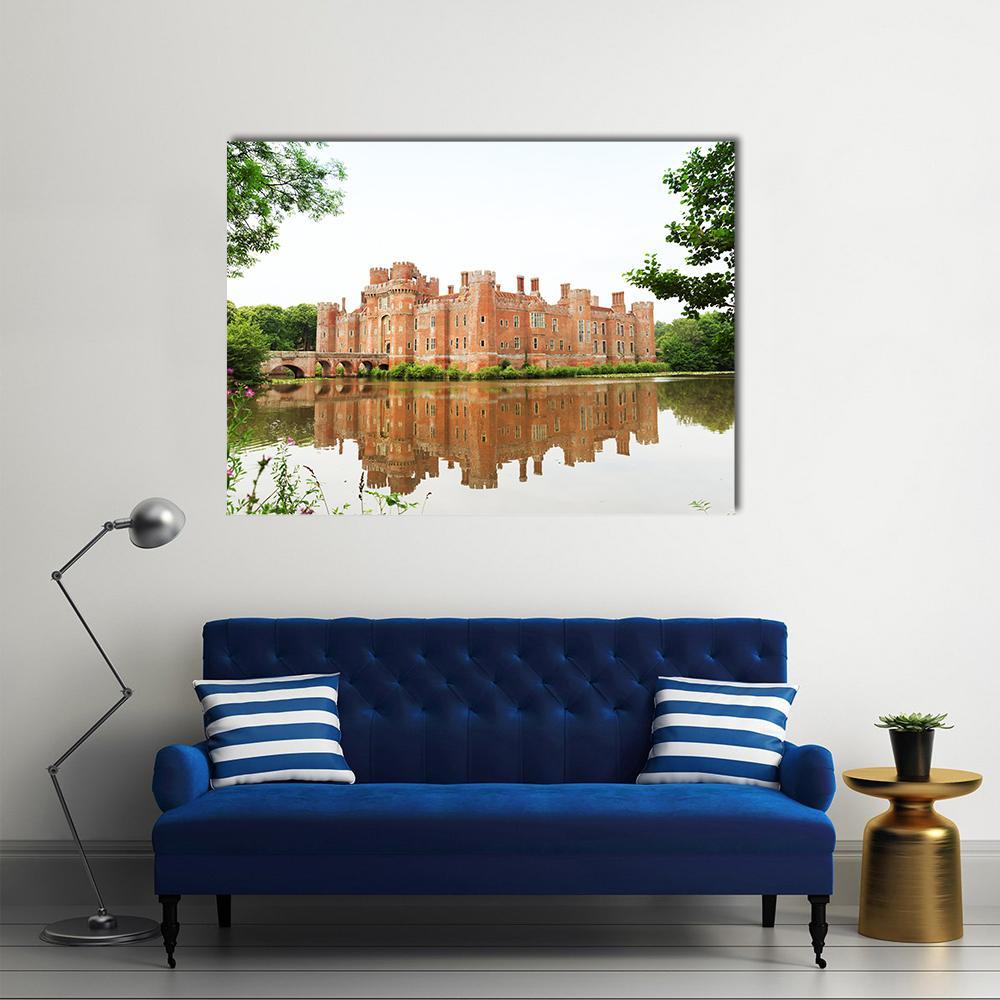 Red Brick Herstmonceux Castle with Reflection Canvas Wall Art in white, red and green, single panel hung on a wall