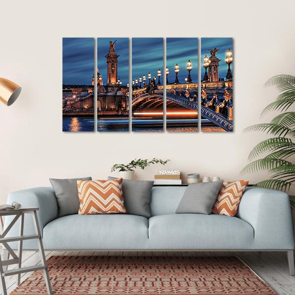 Bridge Alexandre Iii Canvas Wall Art in gold, blue and navy, hung on a wall