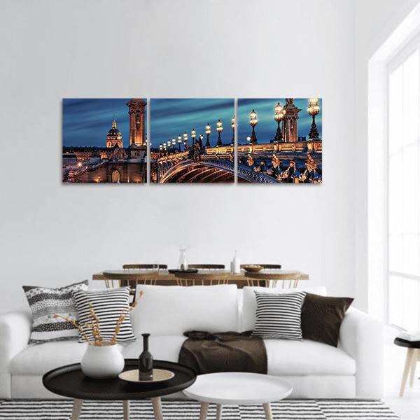 Pont Alexandre Iii Night View Panoramic Canvas Wall Art in black, gold and blue, hung on a wall