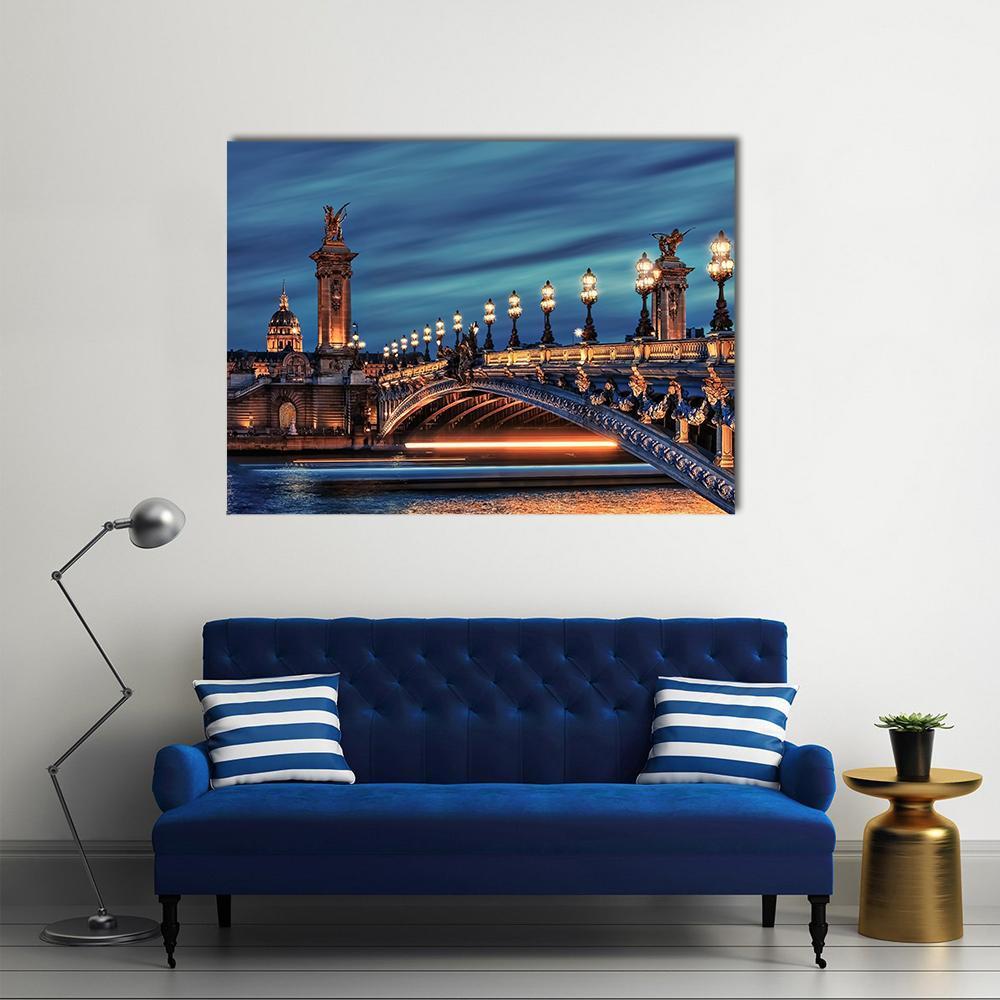 Alexandre Iii Bridge, Paris Twilight Canvas Wall Art in gold, orange and blue, single panel hung on a wall
