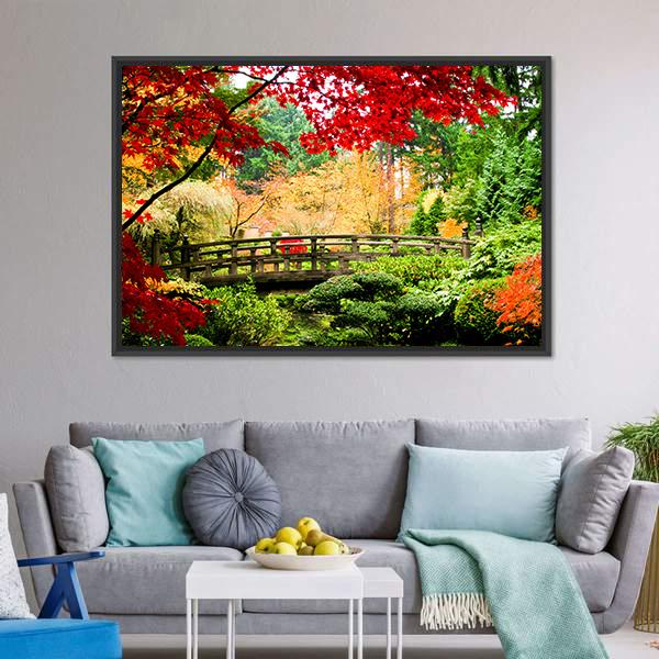 Wooden Bridge in Autumn Garden Canvas Wall Art in red, yellow and green, framed canvas, product view on a white background