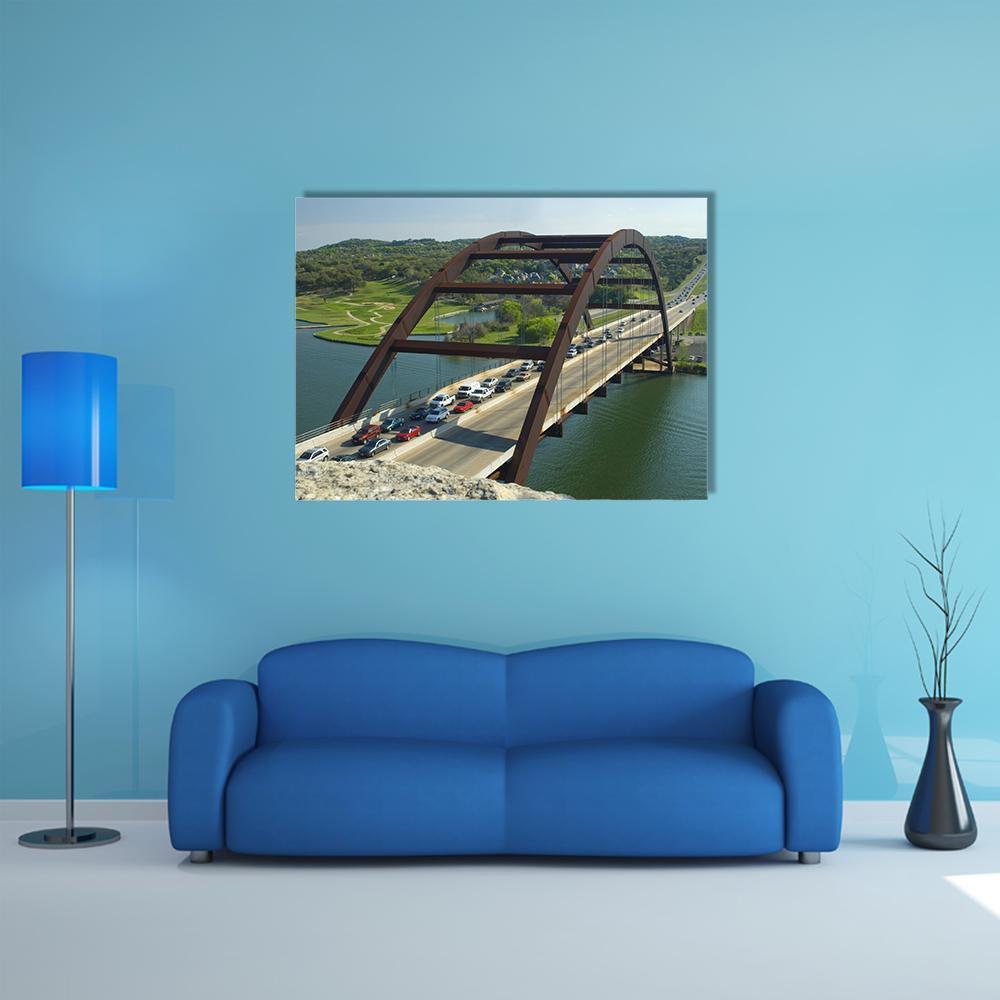 Arch Bridge in Austin, Texas Canvas Wall Art in brown, green and blue, single panel hung on a wall