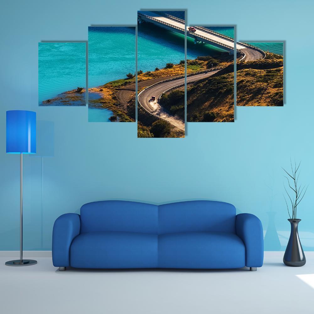 Bridge Over Turquoise River Canvas Wall Art in brown, yellow and blue, 5 panel Star layout hung on a wall