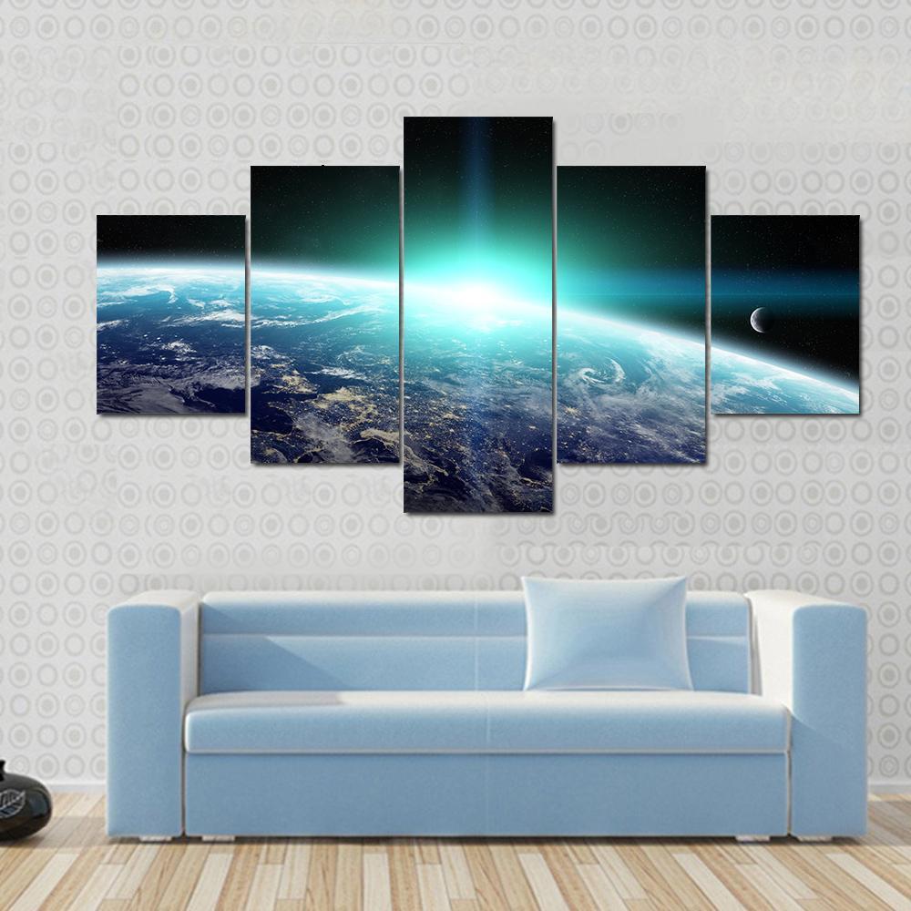 Bright Sun Over Planet Earth Canvas Wall Art in black, white and blue, 5 panel Star layout hung on a wall