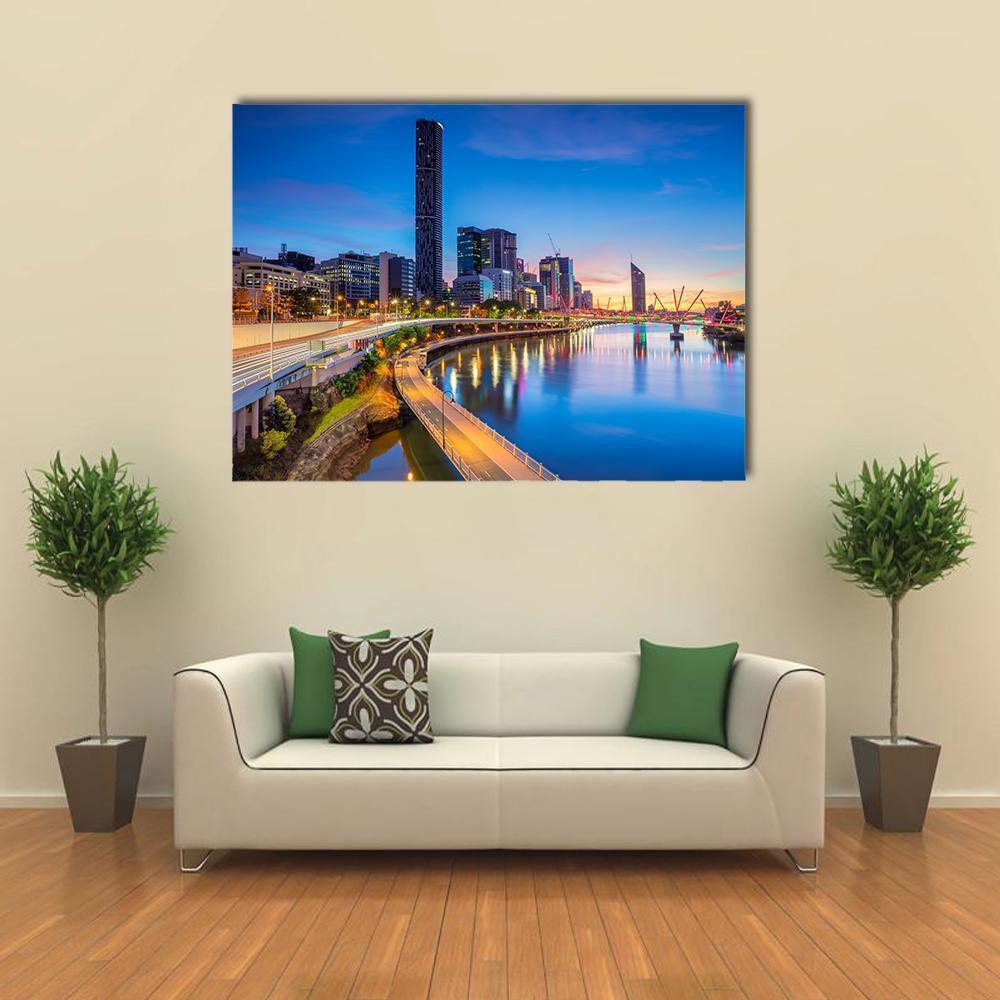 Brisbane Skyline at Sunrise Canvas Wall Art in orange, yellow and blue, single panel hung on a wall