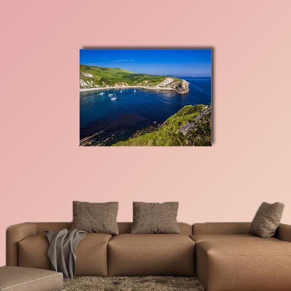 British Seaside Bay with Sailboats Canvas Wall Art in green and blue, single panel hung on a wall