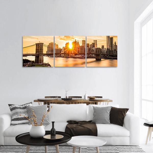 Brooklyn Bridge and Manhattan Skyline Panoramic Canvas Wall Art in brown, orange and yellow, hung on a wall
