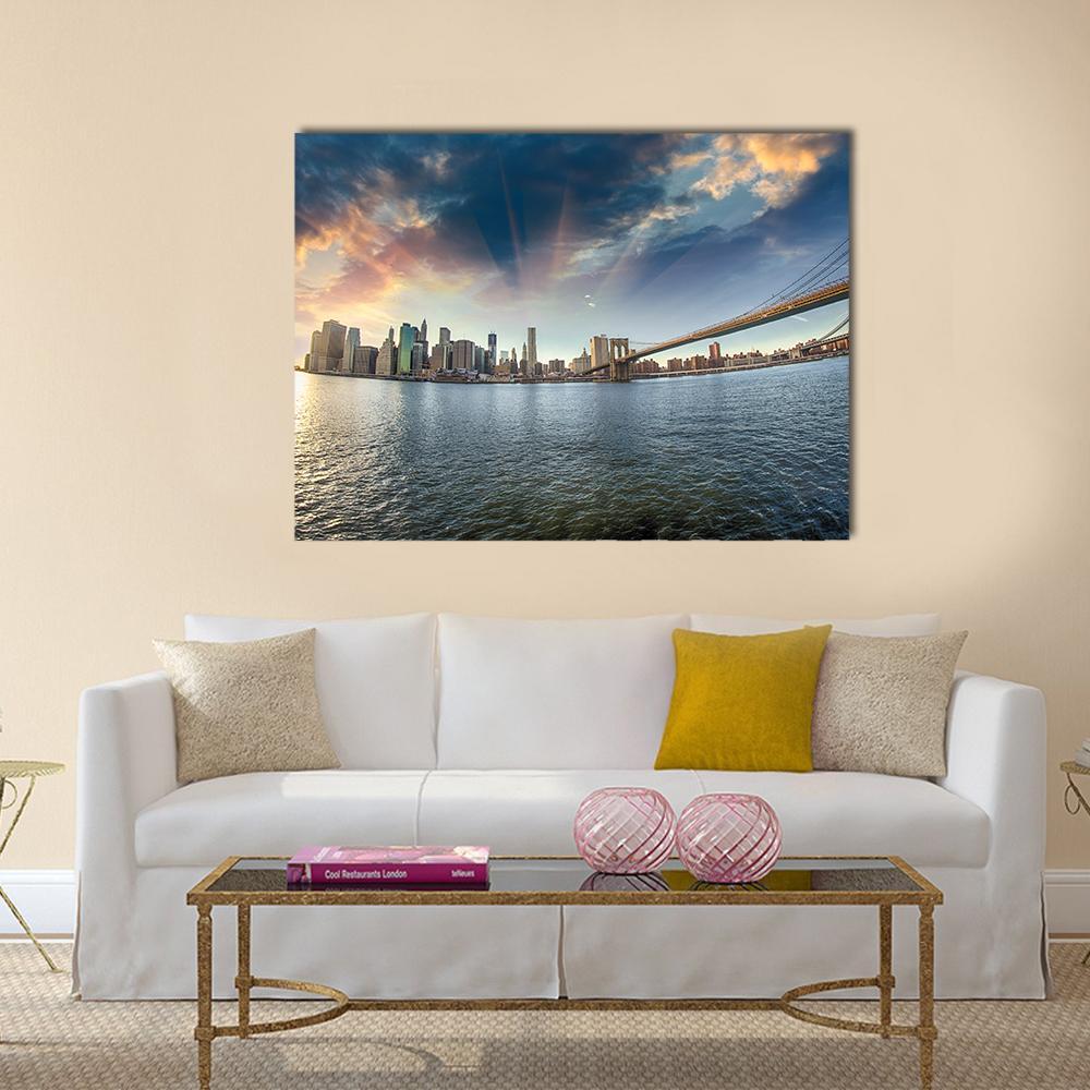Brooklyn Bridge at Sunset in Winter Canvas Wall Art in gray, orange and blue, single panel hung on a wall