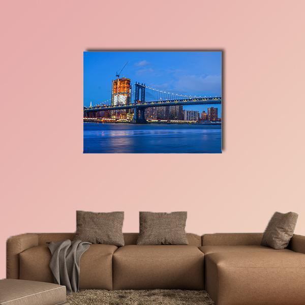 Brooklyn Bridge Over East River Canvas Wall Art in orange and blue, single panel hung on a wall