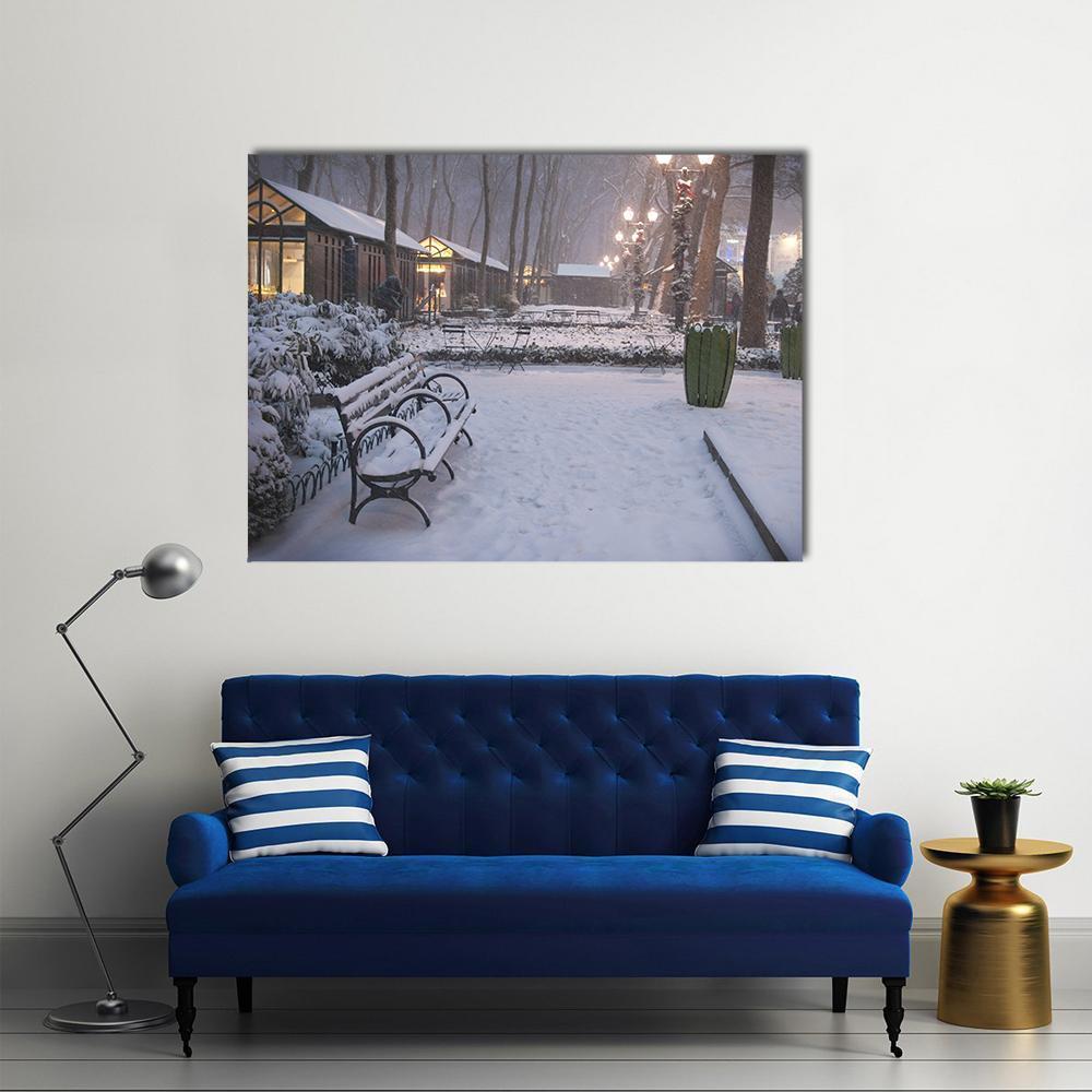 Snowy Night at Bryant Park Canvas Wall Art in white, gray and brown, single panel hung on a wall