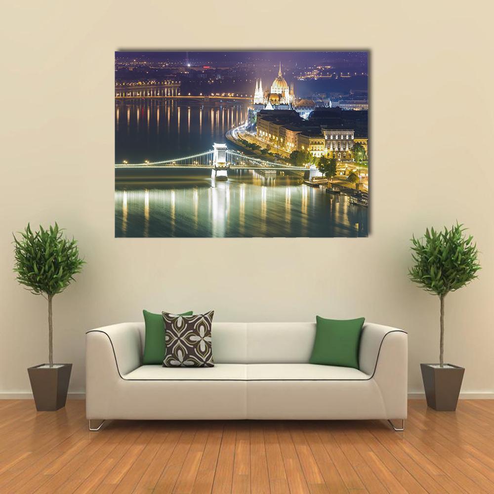 Hungarian Parliament and Chain Bridge at Night Canvas Wall Art in black, gold and yellow, single panel hung on a wall