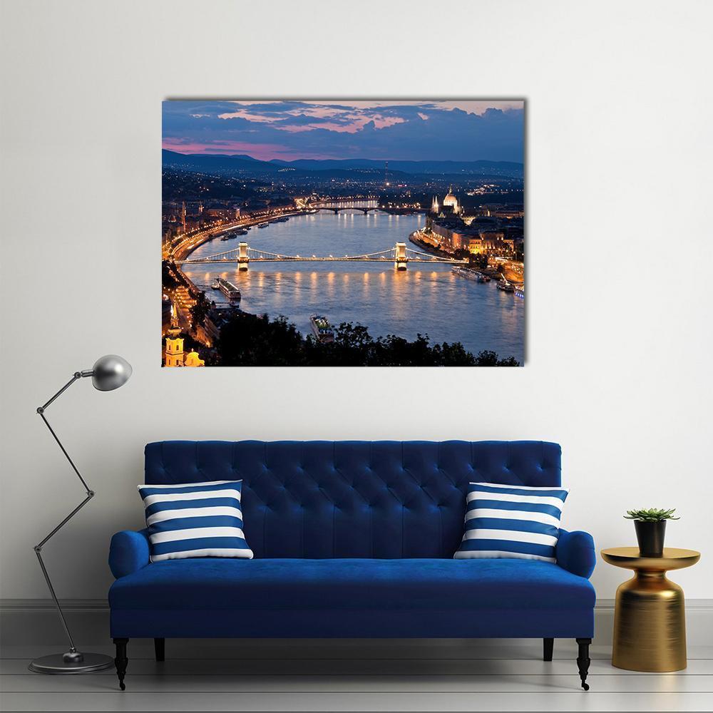 Budapest City Skyline at Night Canvas Wall Art in yellow, blue and navy, single panel hung on a wall