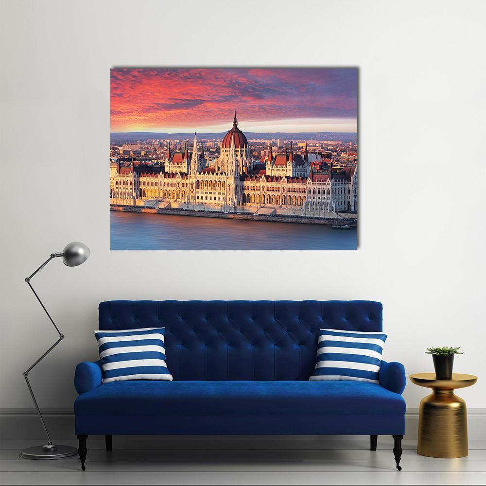 Budapest Parliament at Sunset Canvas Wall Art in gold, orange and blue, single panel hung on a wall