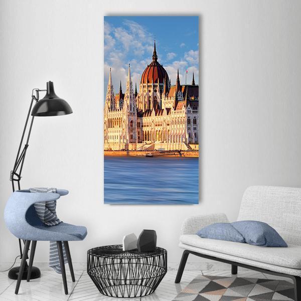 Hungarian Parliament Building, Budapest Vertical Canvas Wall Art in beige, orange and blue, single vertical panel hung on a wall
