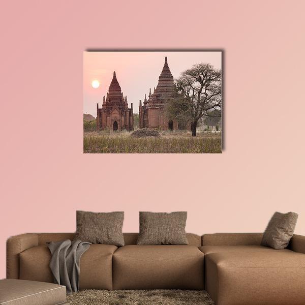 Buddhist Temples at Sunset in Myanmar Canvas Wall Art in brown, orange and pink, single panel hung on a wall