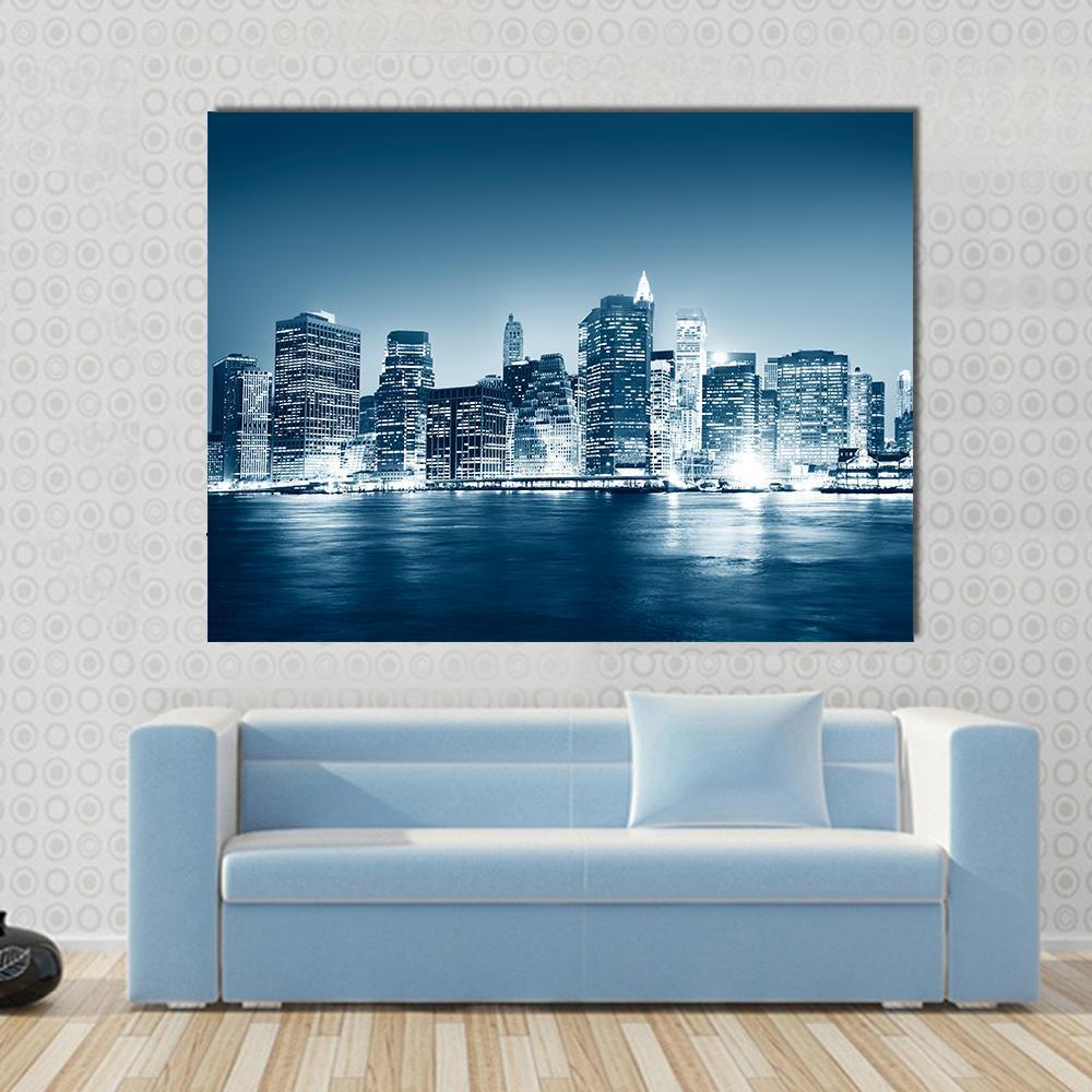 Building Skyscraper Ny Canvas Wall Art in white, blue and navy, single panel hung on a wall