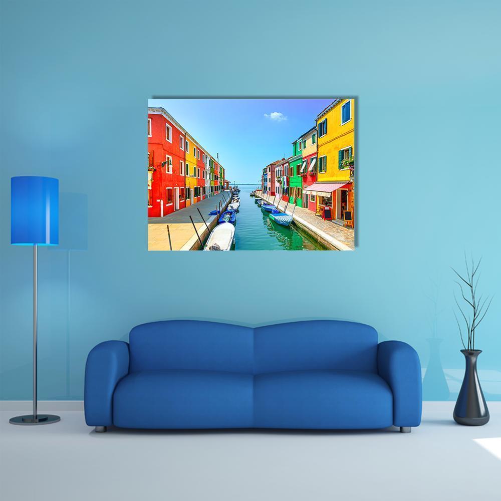 Burano Canal with Colorful Houses Canvas Wall Art in yellow, blue and multicolor, single panel hung on a wall