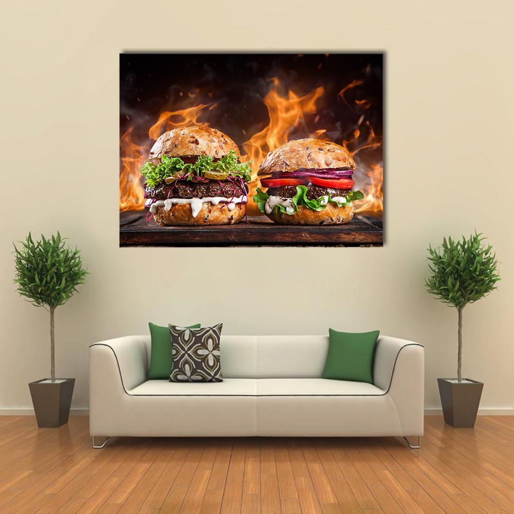 Gourmet Burgers with Flame Background Canvas Wall Art in black, brown and orange, single panel hung on a wall