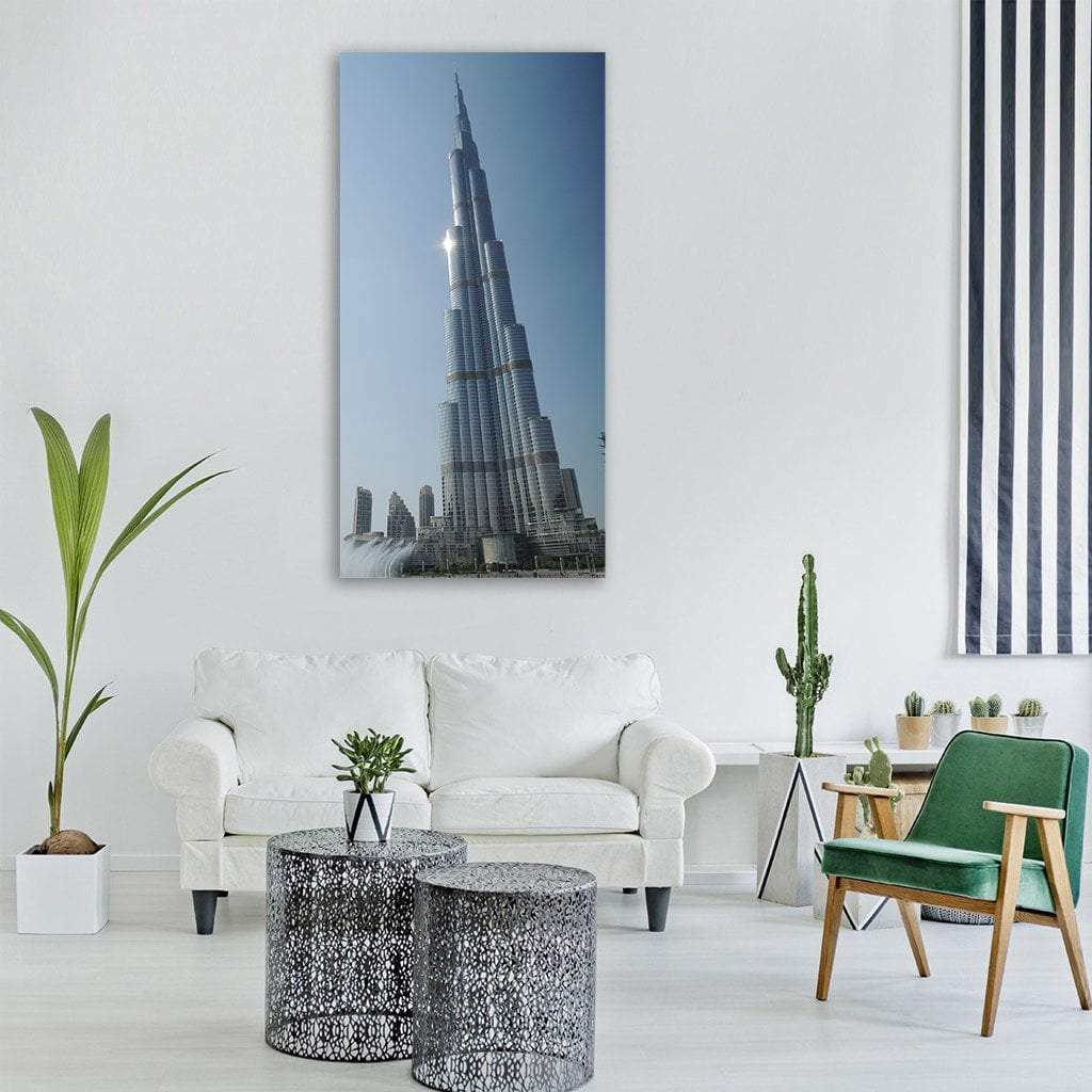 Burj Khalifa Tower Sunlit Spire Vertical Canvas Wall Art in gray, silver and blue, single vertical panel hung on a wall