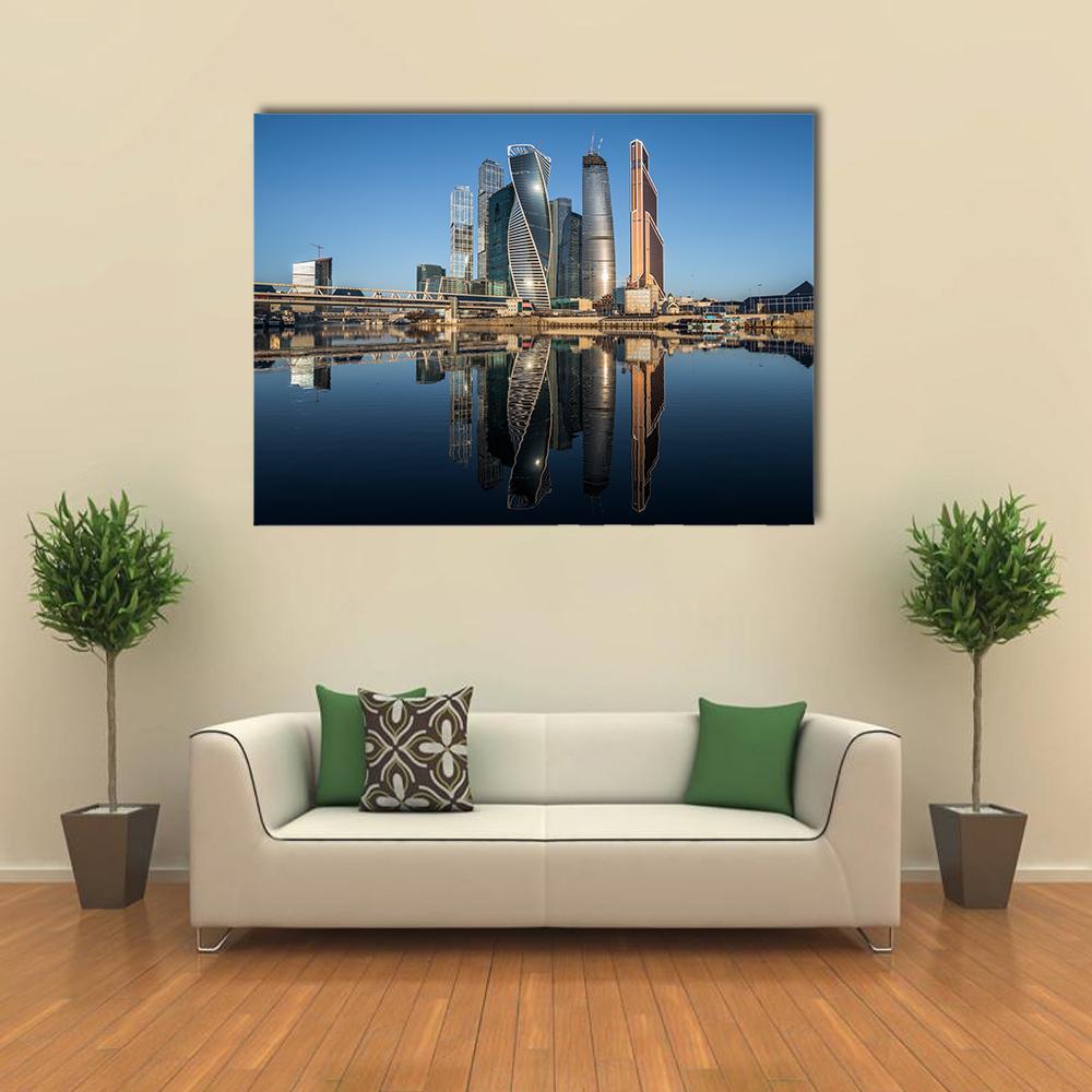Moscow Business Center Canvas Wall Art in gray, blue and navy, single panel hung on a wall
