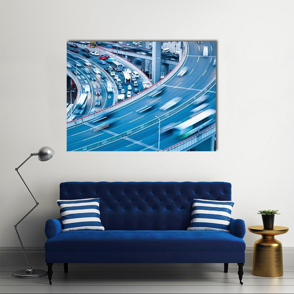 Dynamic City Traffic in Motion Canvas Wall Art in white, gray and blue, single panel hung on a wall