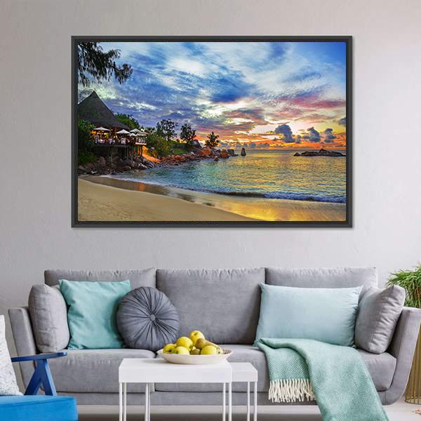 Sunset Cafe on Tropical Beach Canvas Wall Art in orange, yellow and blue, framed canvas, product view on a white background