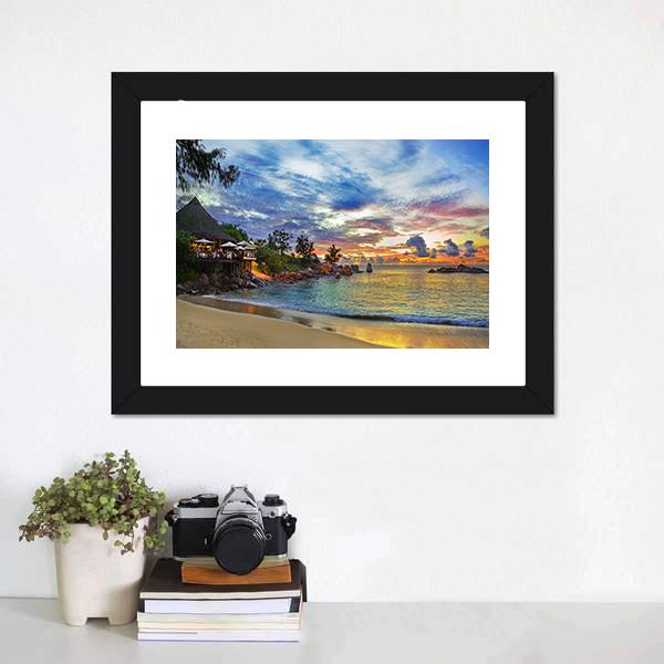 Sunset Cafe on Tropical Beach Canvas Wall Art in orange, yellow and blue, framed print, product view on a white background