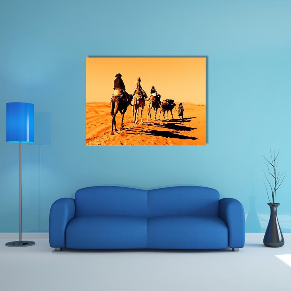 Camel Caravan in the Desert Canvas Wall Art in brown, orange and yellow, single panel hung on a wall