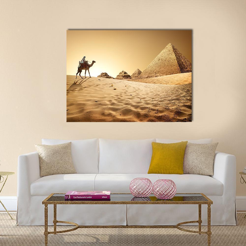 Camel by the Great Pyramids Canvas Wall Art in beige, gold and yellow, single panel hung on a wall