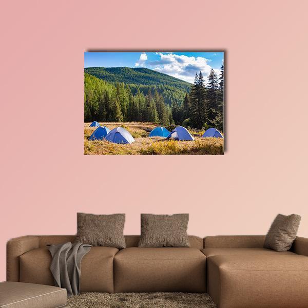 Blue Camping Tents in Mountain Meadow Canvas Wall Art in brown, green and blue, single panel hung on a wall