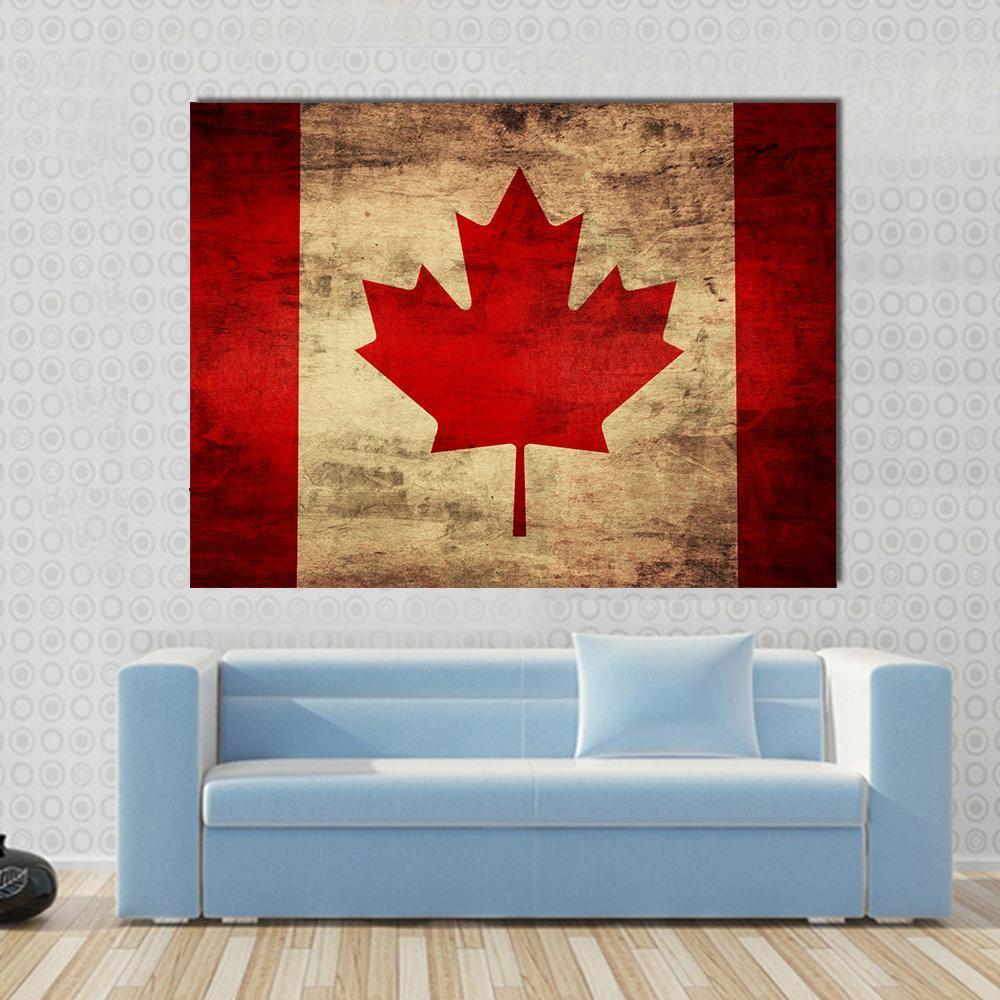 Grunge Canadian Flag Canvas Wall Art in beige, brown and red, single panel hung on a wall