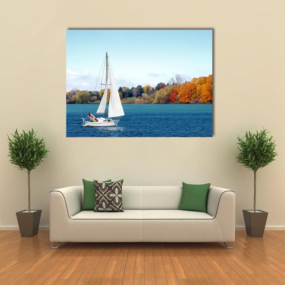 Canadian Sailboat on Lake Canvas Wall Art in white and blue, single panel hung on a wall