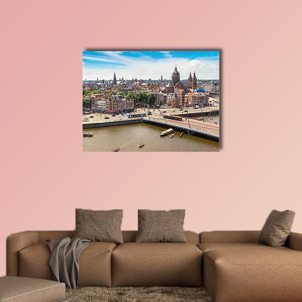 St. Nicolas Church Over Amsterdam Canal Canvas Wall Art in gray, brown and blue, single panel hung on a wall