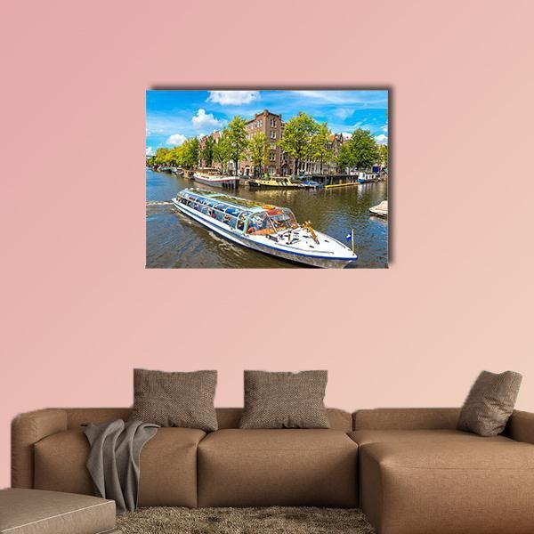Glass-roofed Boat on Amsterdam Canal Canvas Wall Art in brown, green and blue, single panel hung on a wall