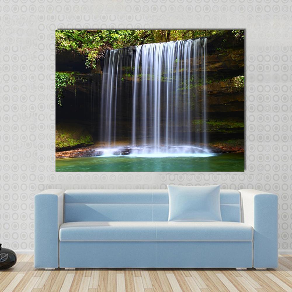 Caney Creek Waterfalls Canvas Wall Art in white, brown and green, single panel hung on a wall