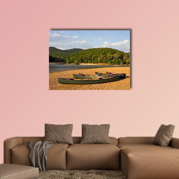 Canoes on the Buffalo River Bank Canvas Wall Art in brown, green and blue, single panel hung on a wall
