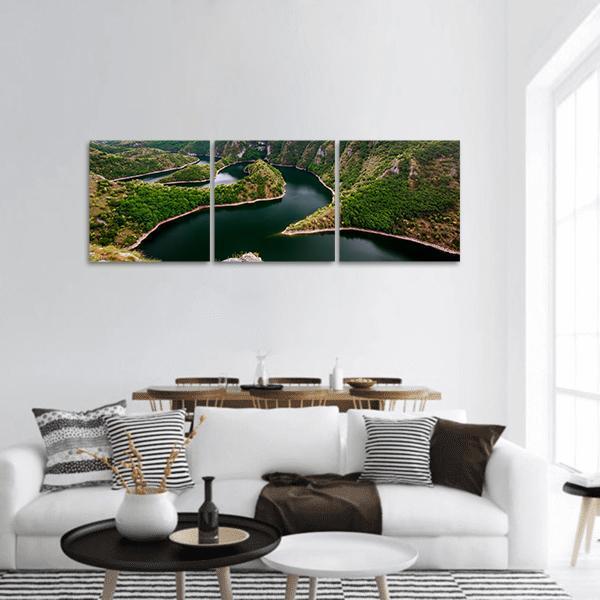 Curving River in Green Canyon Panoramic Canvas Wall Art in brown and green, hung on a wall
