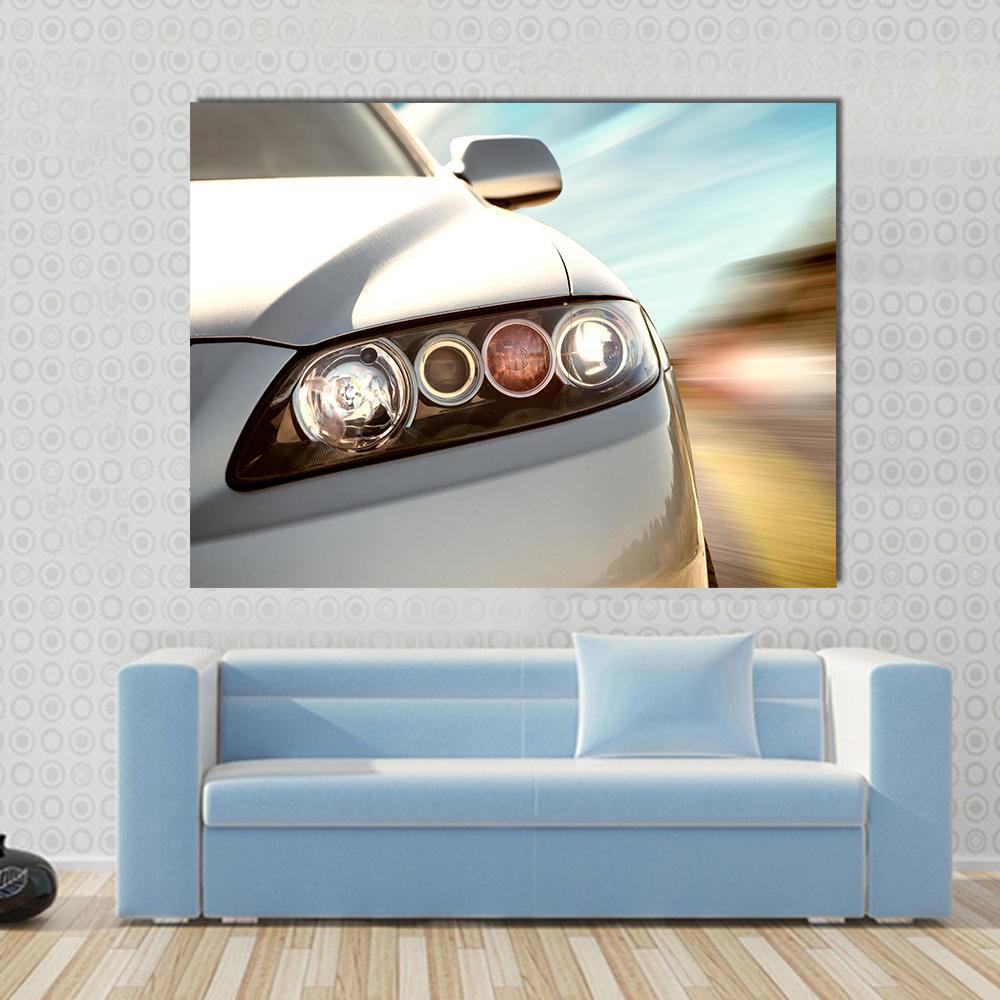 Car Driving on a Motorway at High Speeds Canvas Wall Art in white, gray and blue, single panel hung on a wall