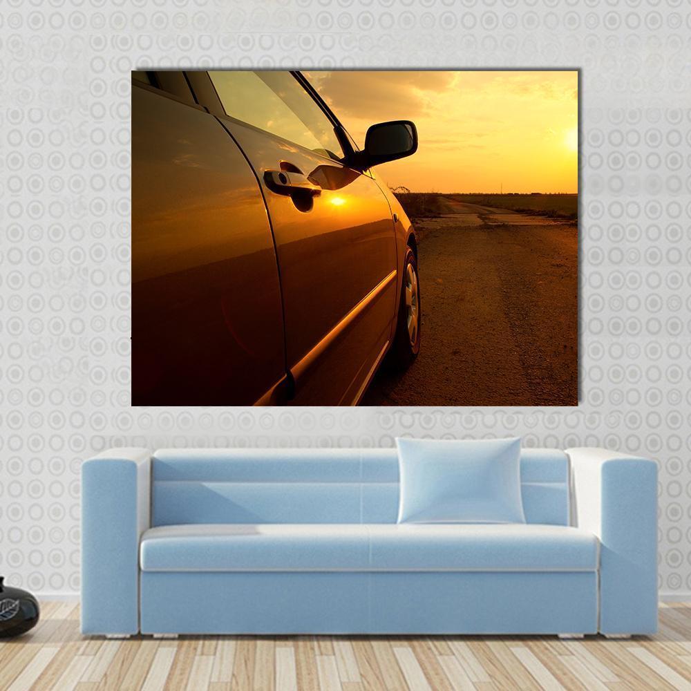 Car in the Sunset Canvas Wall Art in brown, orange and yellow, single panel hung on a wall